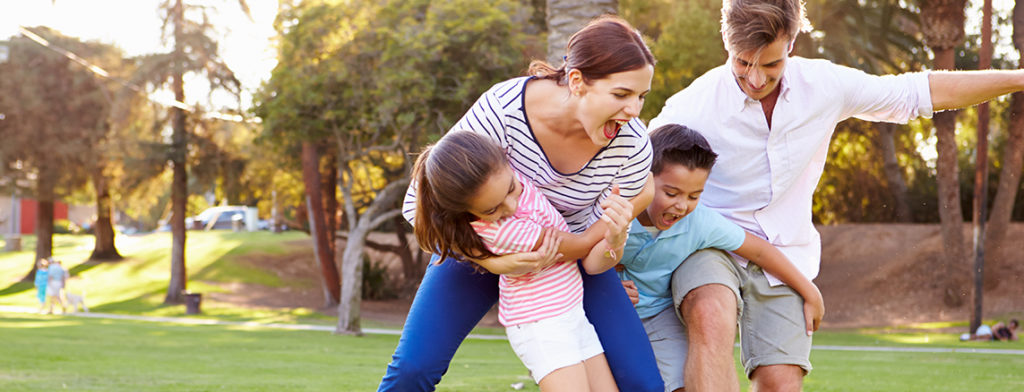 Family playing in the park.
