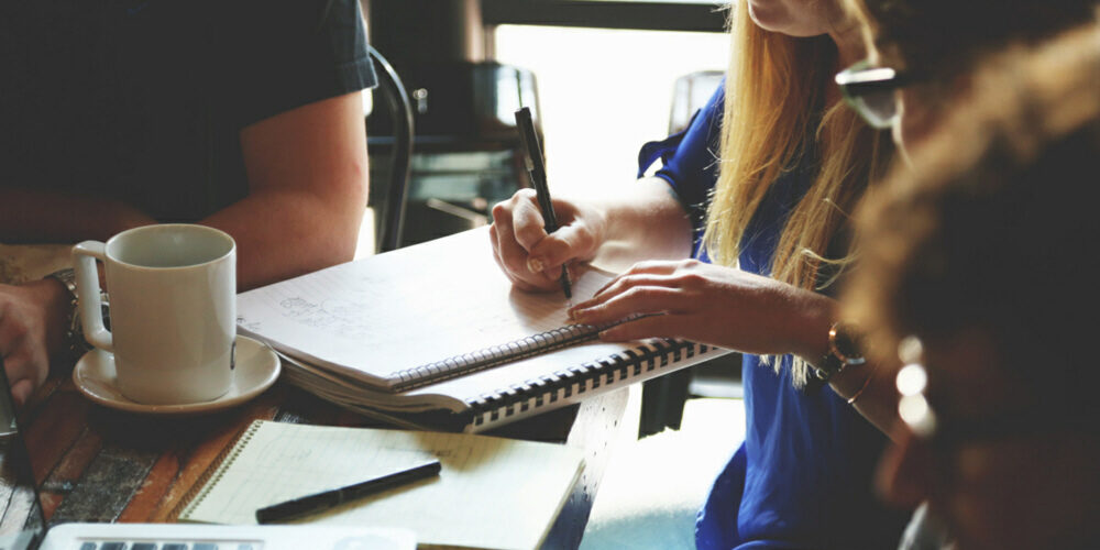 Professionals meeting around a table.