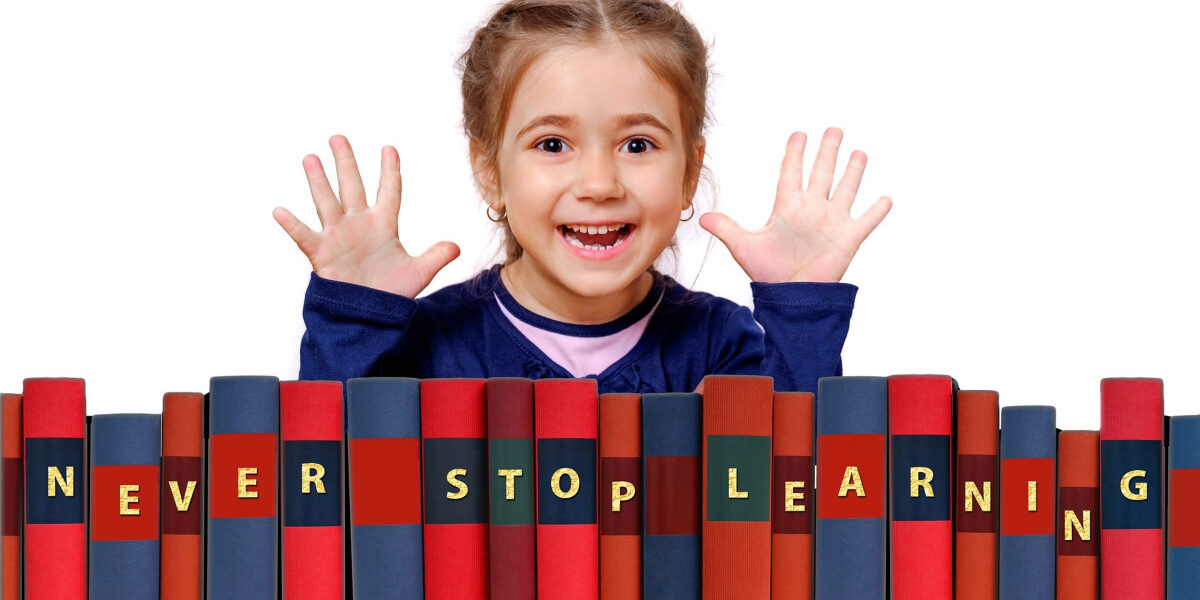 girl with books saying never stop learning