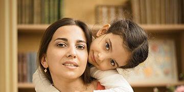 A child and her mother.